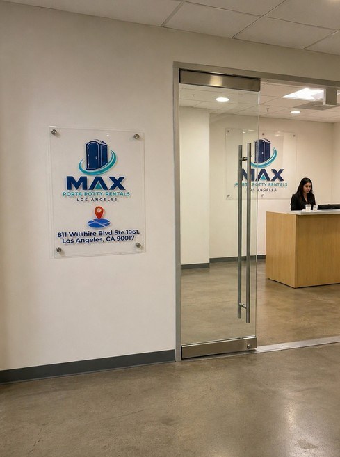 Max Porta Potty Rentals storefront with branded acrylic signage and reception inside